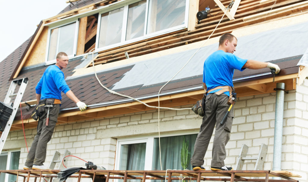 PDX Roofing and Siding crew working on a residential roof replacement in Portland